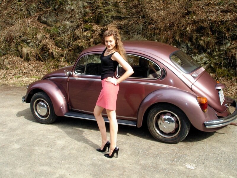 Woman Standing by Car — Maroon