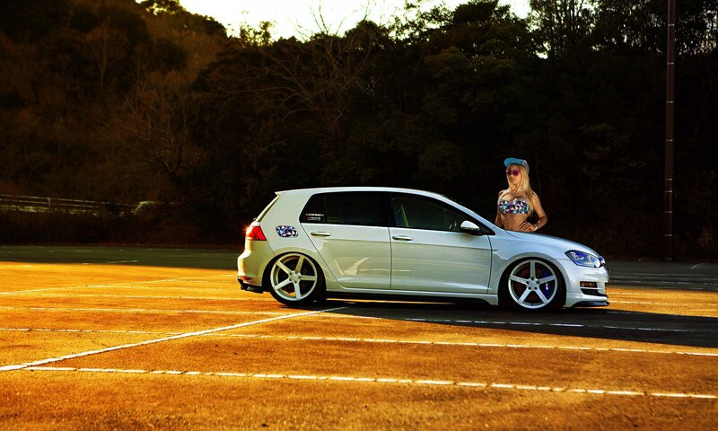 Woman Standing by Car — White, Dramatic, Sunset