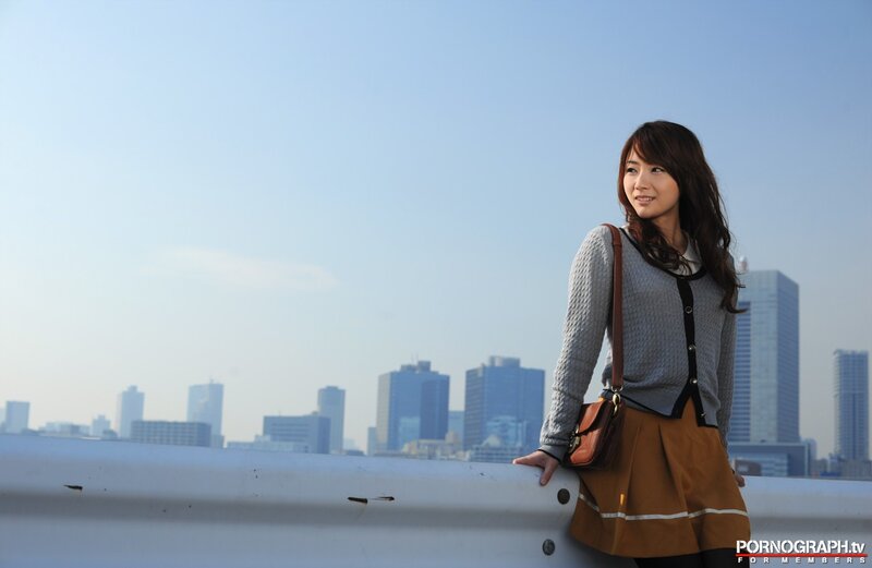 woman standing by city skyline