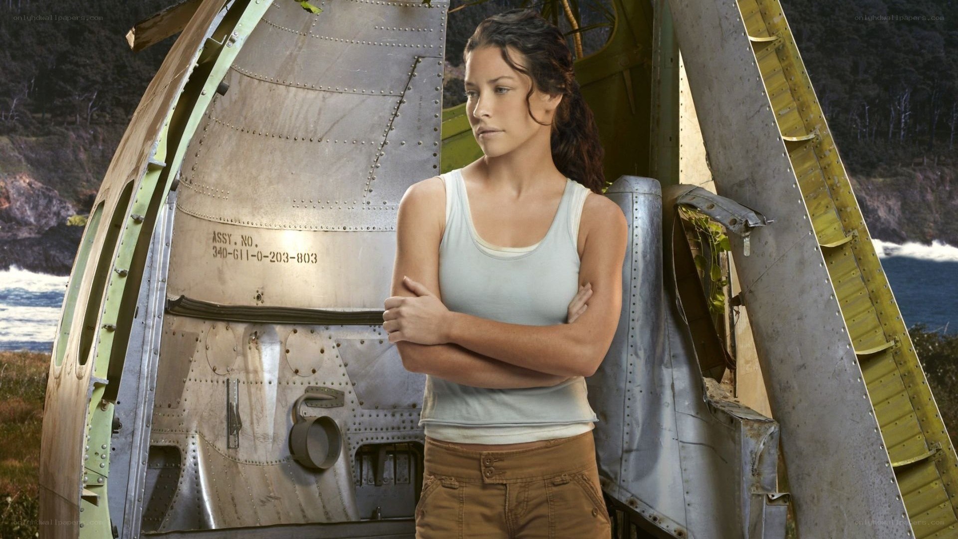 woman standing by crashed plane