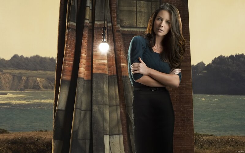 Woman Standing by Curtain