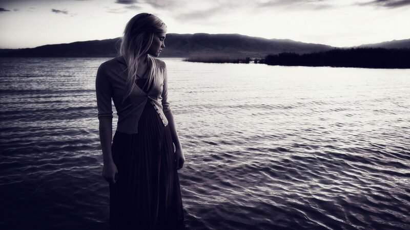 Woman Standing by Lake — Black
