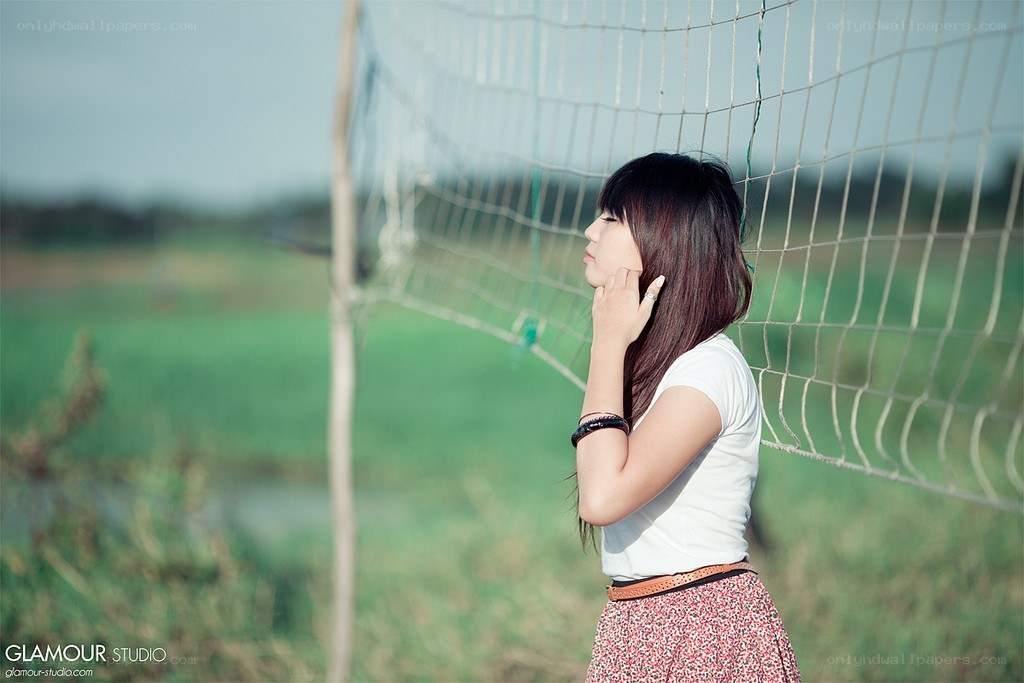 woman standing by net