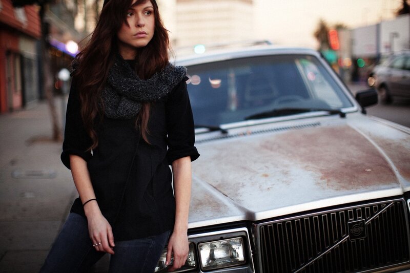 woman standing by old volvo