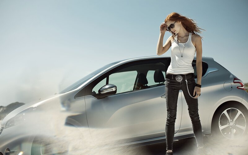 woman standing by silver car
