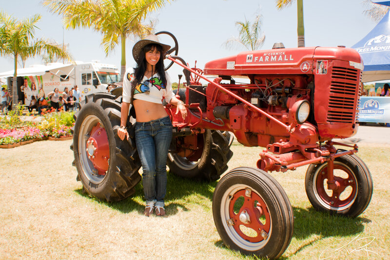 Woman Standing by Tractor