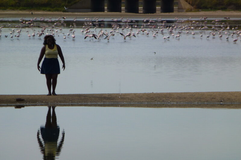 Woman Standing by Water — Blue