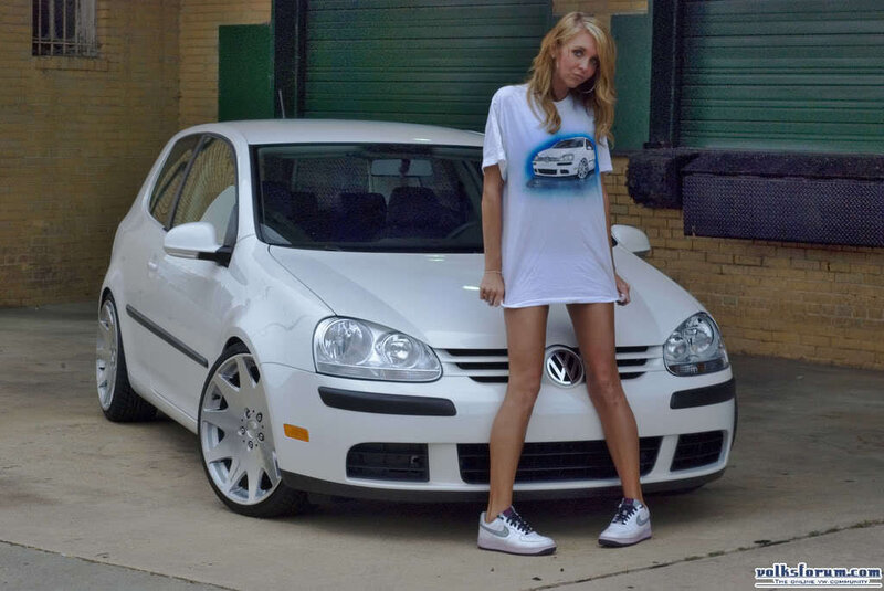 woman standing by white car