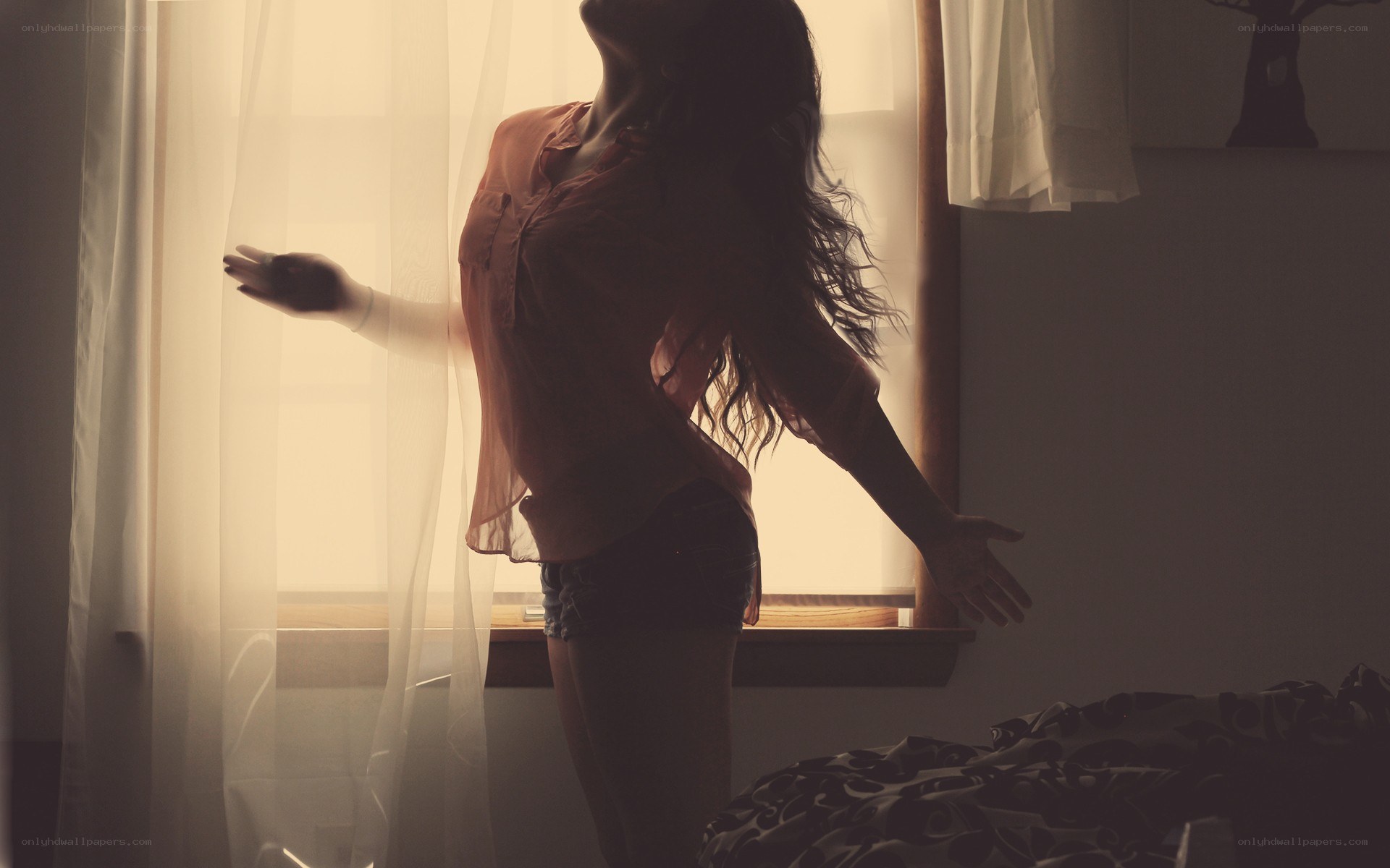 woman standing by window