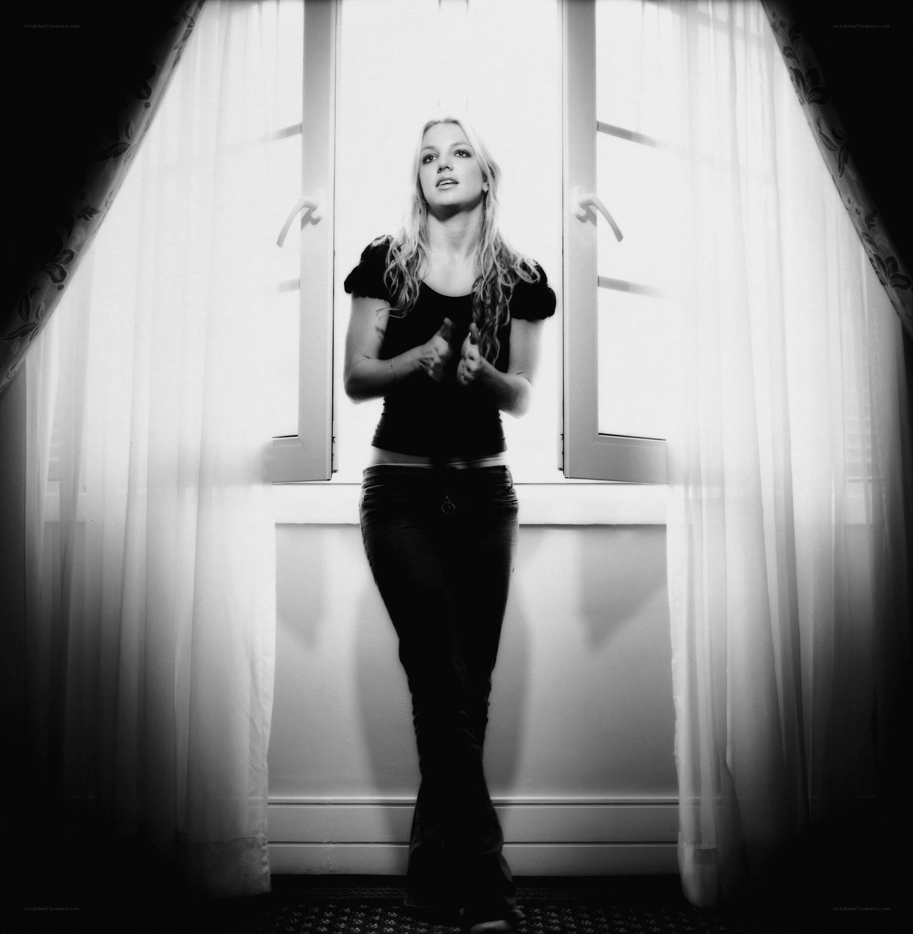 woman standing by window
