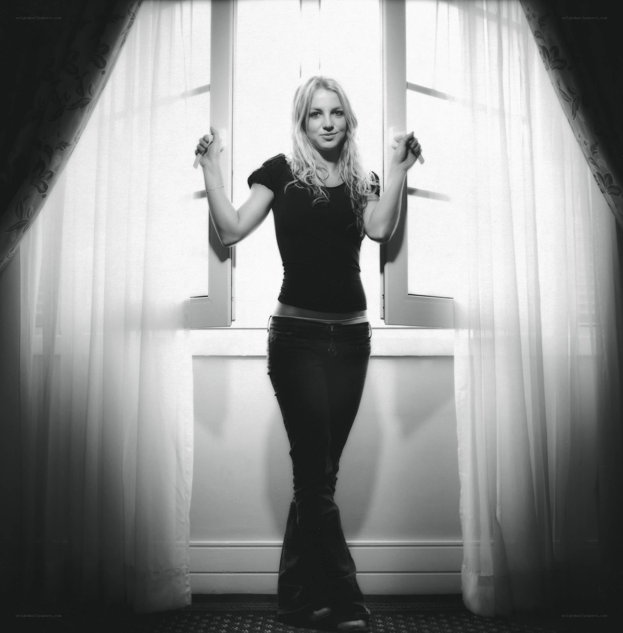 woman standing by window