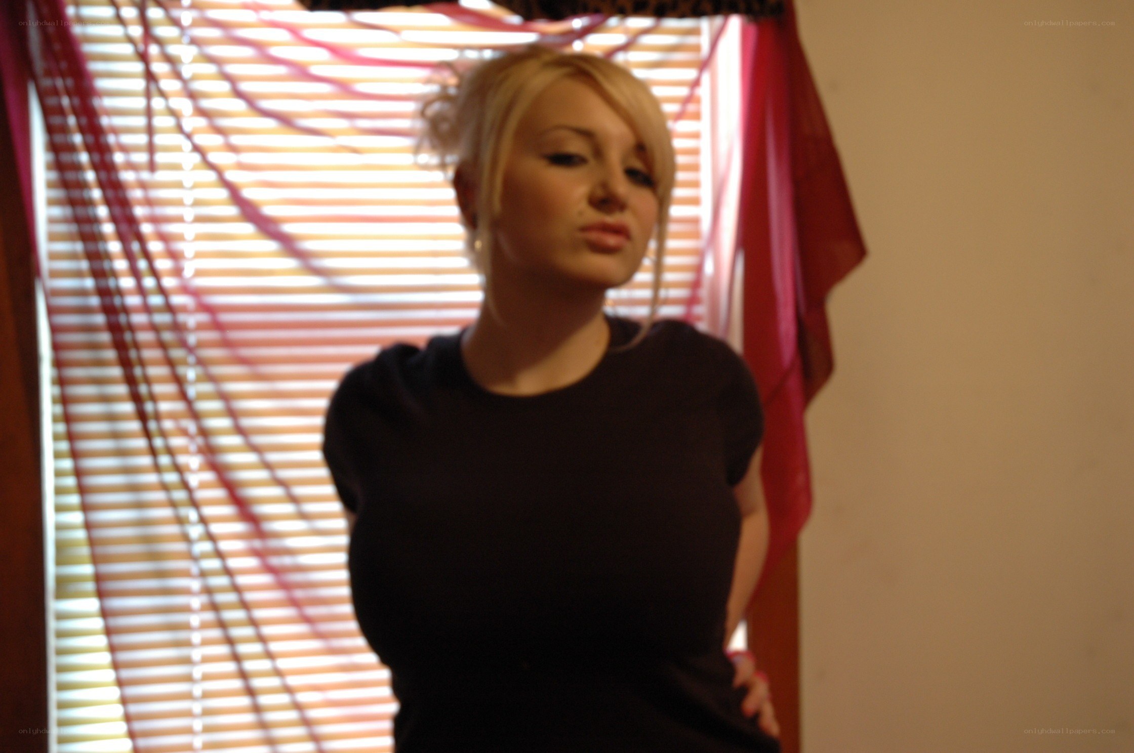 woman standing by window