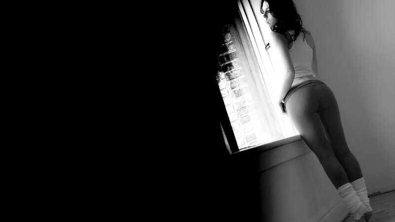 Woman Standing by Window — Black