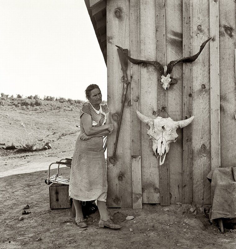 Woman standing by wooden cabin