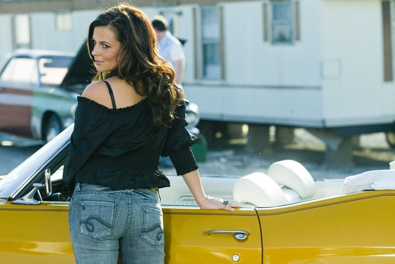 woman standing by yellow car