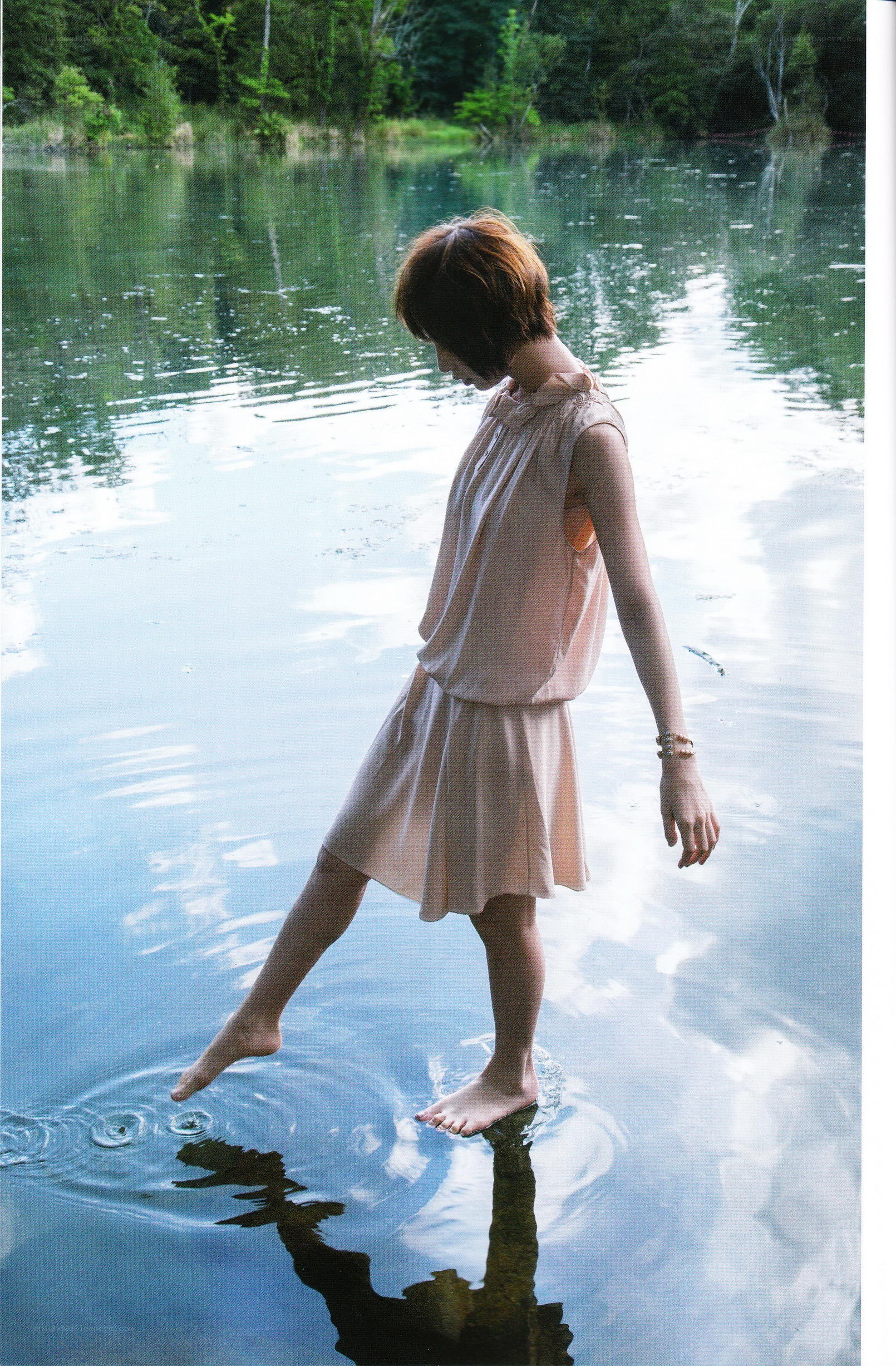 woman standing in a lake