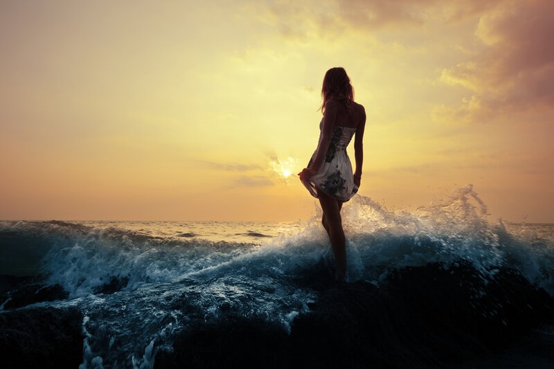 Woman Standing in Ocean — Yellow