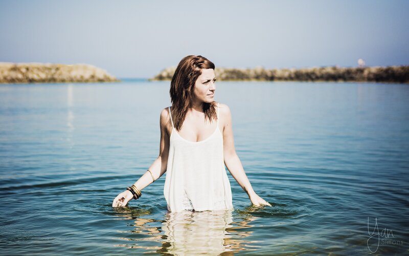 Woman Standing in Water — Blue, Serene, Afternoon
