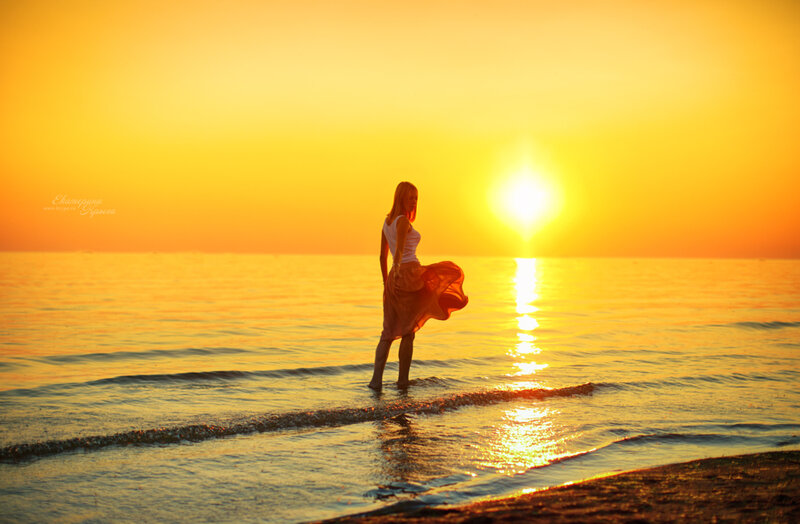 Woman Standing in Water — Yellow