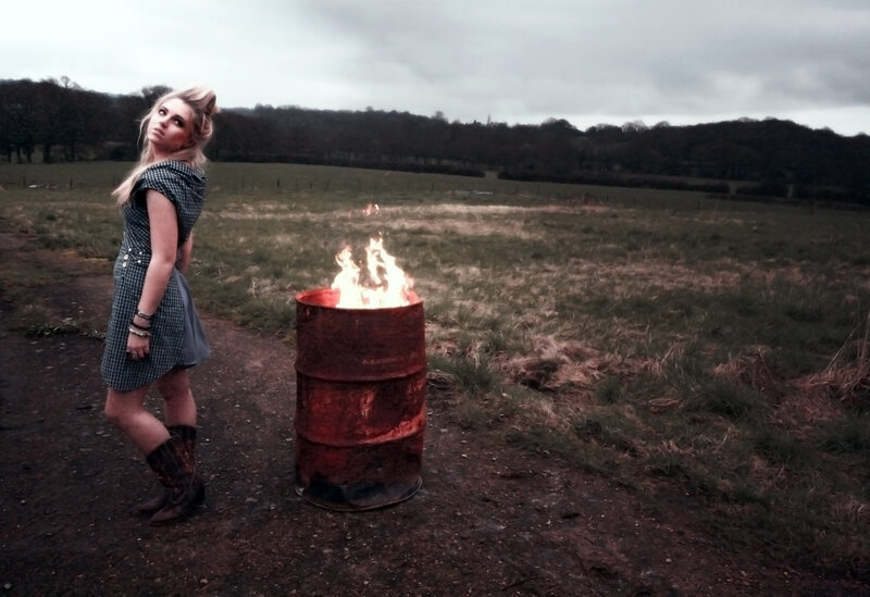 Woman Standing Near Fire Barrel