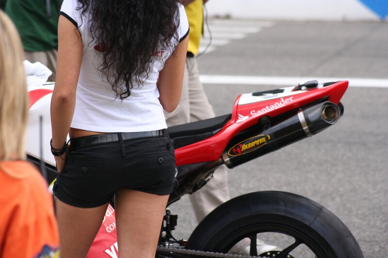 woman standing near motorcycle