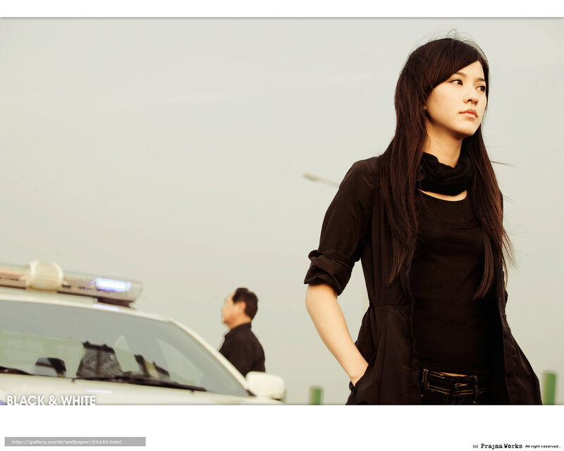 woman standing near police car