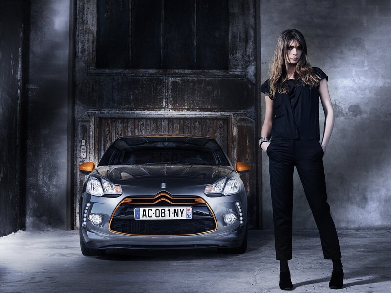 Woman standing next to a car