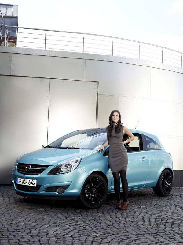 woman standing next to a car