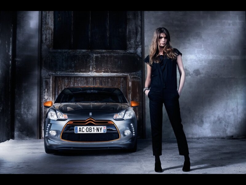 woman standing next to car