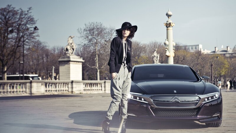 woman standing next to car
