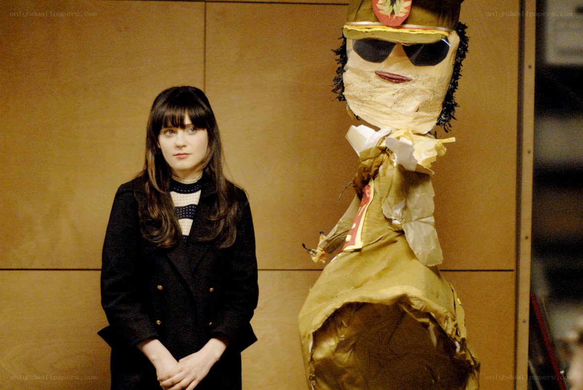 woman standing next to puppet