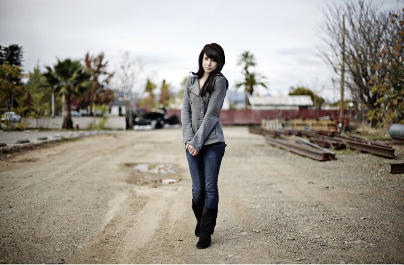 woman standing on a dirt road
