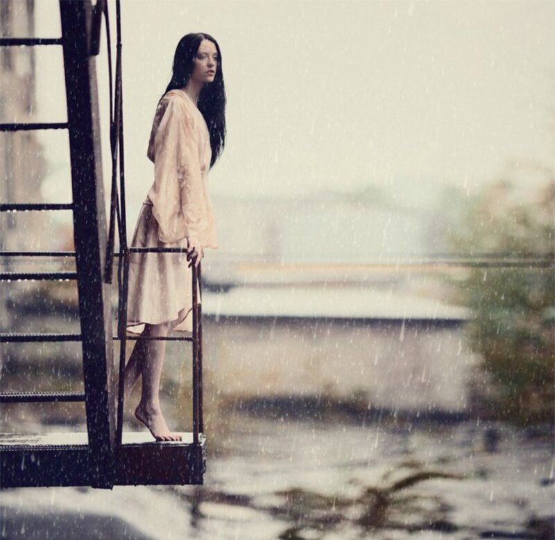 Woman Standing on Ladder