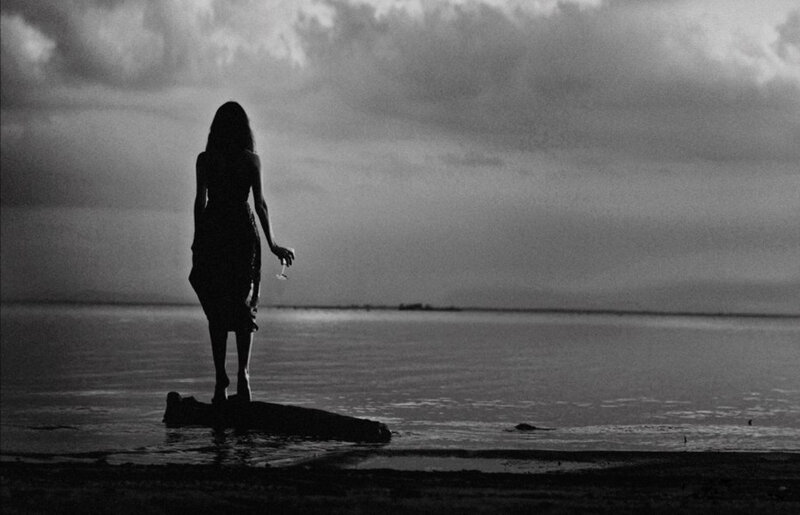 Woman Standing on Log