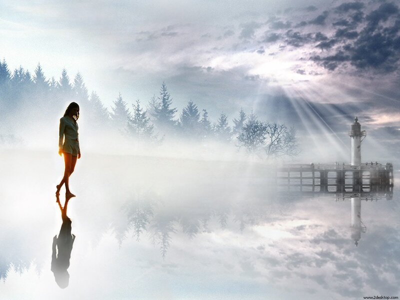 woman standing on misty lake