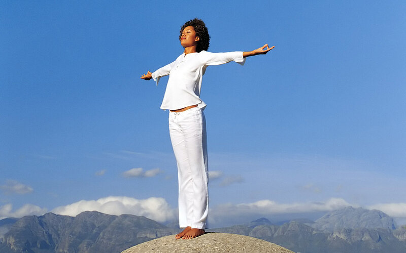 Woman Standing on Rock