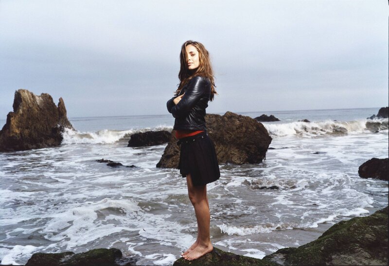 Woman Standing on Rocks — Black