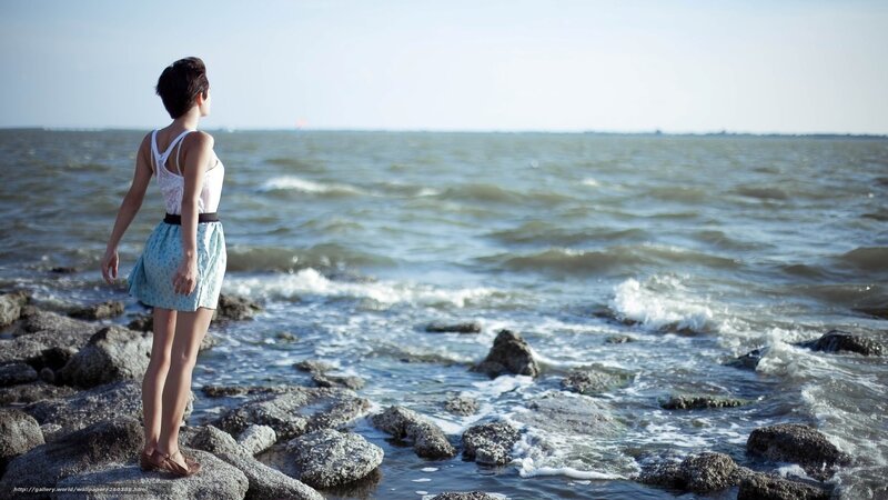 Woman Standing on Rocks — Blue