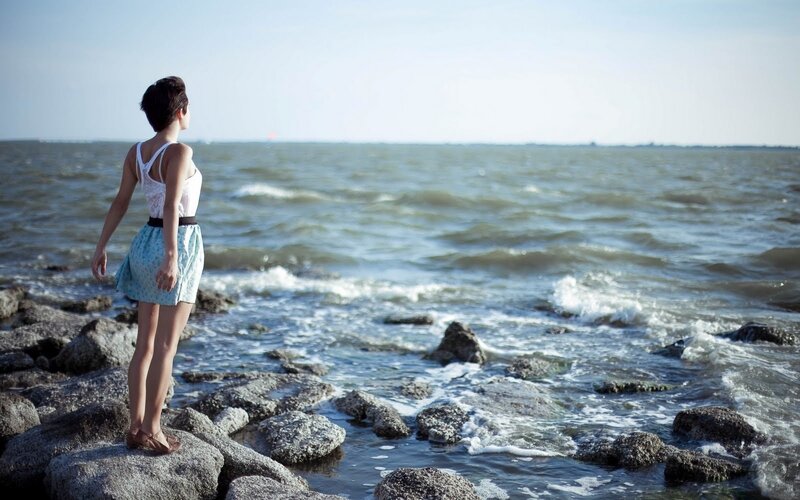 Woman Standing on Rocks