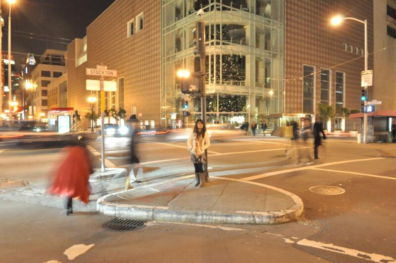 Woman Standing on Sidewalk — Brown