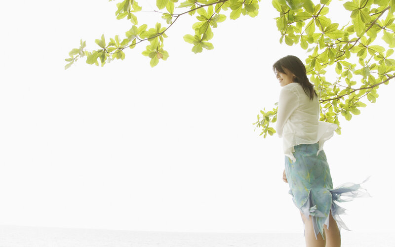 Woman Standing under Tree