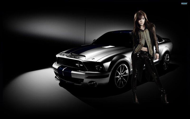 Woman Standing with Car — Black, Dramatic, Photograph