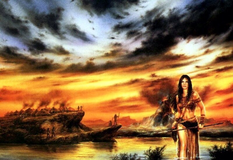 Woman stands by river at sunset
