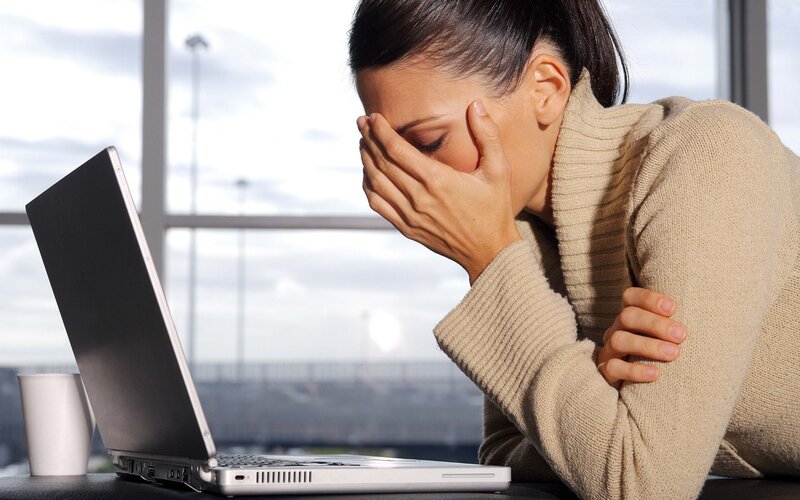 woman stressed at laptop