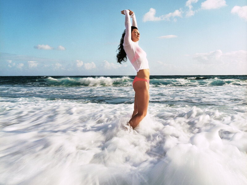 Woman stretching at the beach