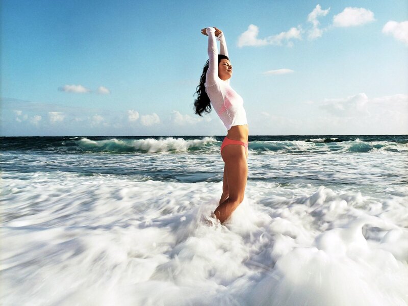 Woman stretching at the beach