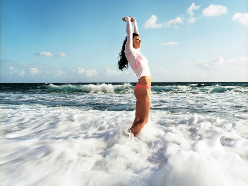 Woman stretching at the beach