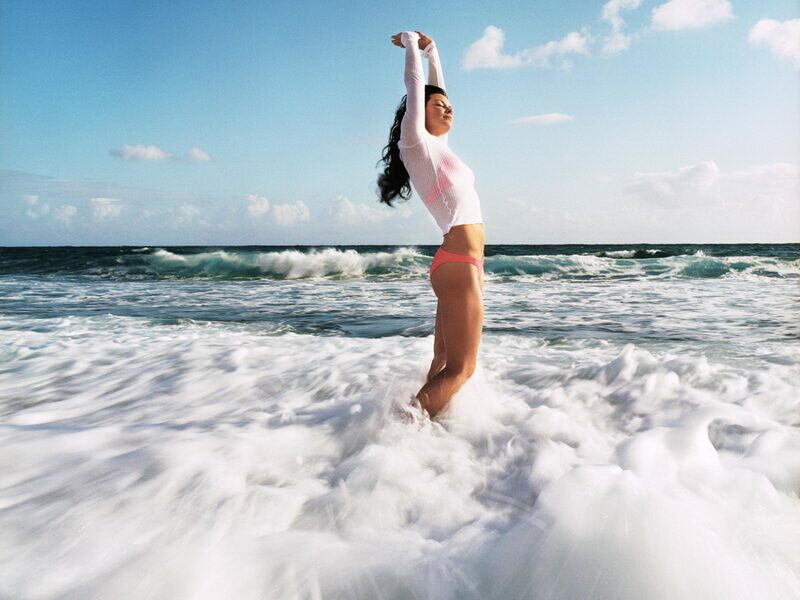 Woman stretching at the beach
