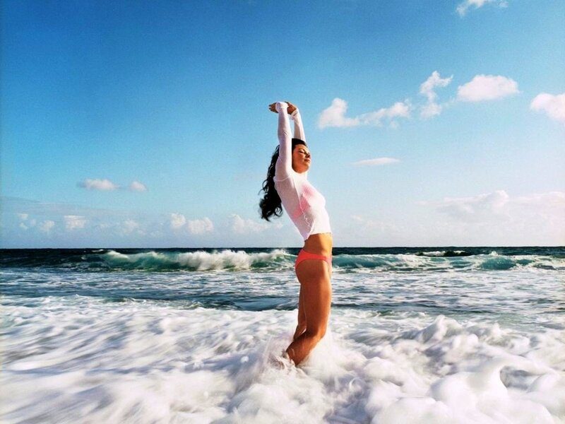 Woman stretching at the beach