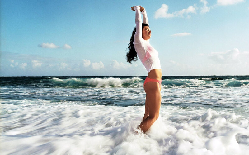 Woman stretching at the beach